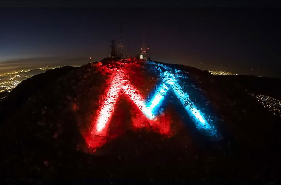 The M lit red, white and blue